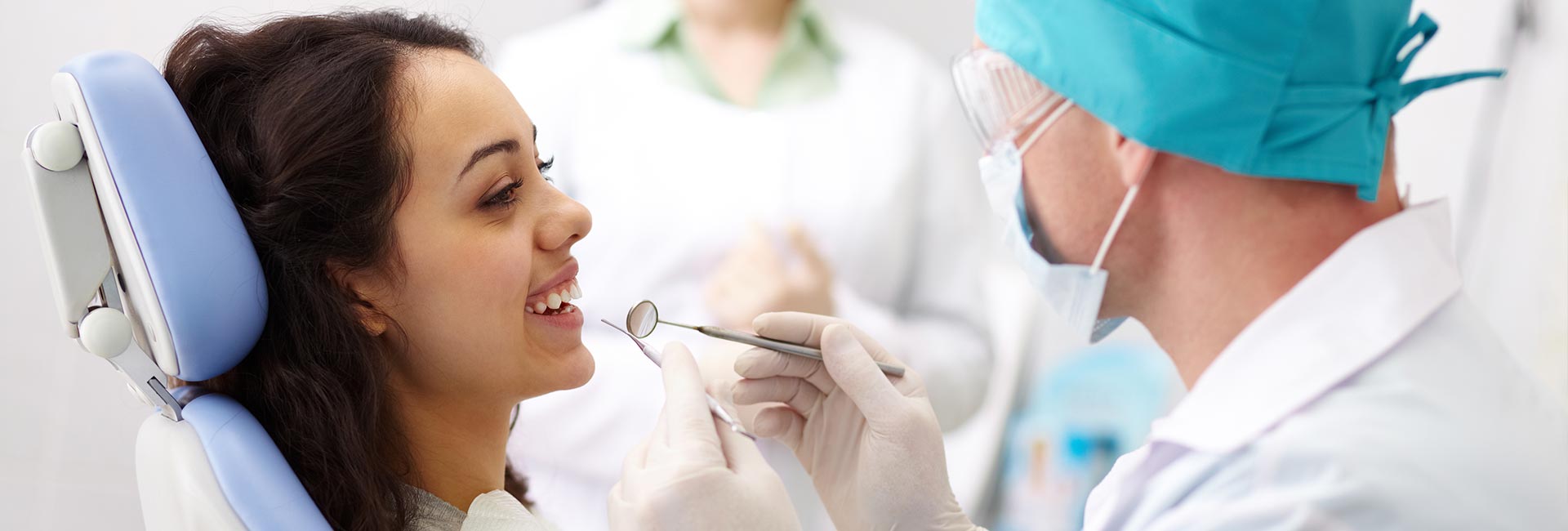 Doctor examining a woman's teeth.jpg